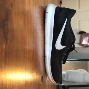 Black and white nike tennis shoes